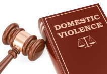 Domestic violence concept with gavel and book, 3D rendering